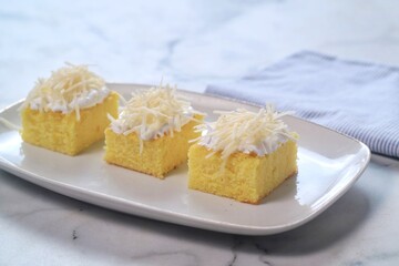 Sliced Sponge Cake , fresh baked fluffy cake with cheese topping