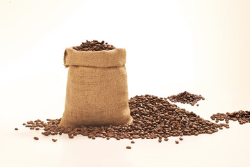 Natural fiber bag with coffee beans inside.