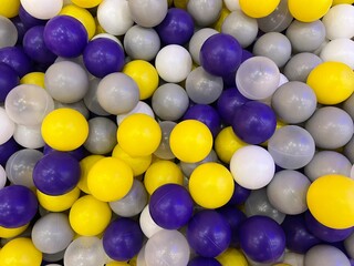 yellow gray white and purple olored balls background
