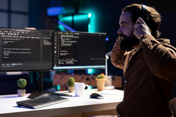 Programmer enjoying podcasts and futureproofing company network from downtimes and unexpected...