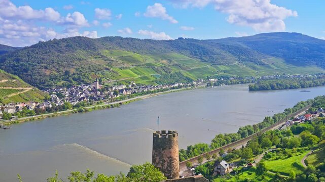 Scenic aerial panoramic view of the Rhine River Valley featuring small river side towns, vineyards, and rolling hills on a sunny summer day, Upper Middle Rhine, Germany