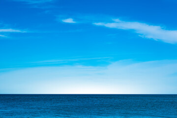 Nature of the beach and sea Summer with sunshine, sandy beaches, clear blue waters sparkling against the blue sky. On an island with good ecology and environment Background for summer vacation