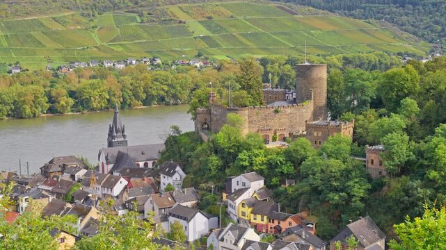 Panoramic aerial view of the small town of Niederheimbach on the Rhine River and the surrounding hillside vineyards, Rhine Valley, Germany 