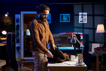 Programmer starting job shift, ready to do software quality assurance and read source code on...