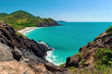 Obraz premium Serene Coastal Landscape Featuring Rocky Cliffs and Clear Turquoise Waters Under a Bright Blue Sky on a Sunny Day