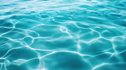 Obraz premium Serene turquoise water surface with gentle ripples