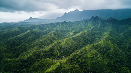 Fototapeta premium Lush green mountain range landscape aerial view