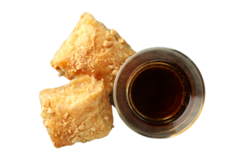 PNG, Ramadan. Baklava in a plate with a glass of tea,.isolated on a white background.