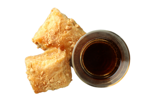 PNG, Ramadan. Baklava in a plate with a glass of tea,.isolated on a white background.