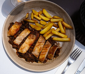Iberian pork in sweet wine with stewed vegetables. Spanish dish