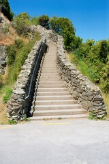 Rustic Stairway Up a Hill on a Sunny Day – Scenic Outdoor Pathway