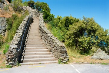 Rustic Stairway Up a Hill on a Sunny Day – Scenic Outdoor Pathway