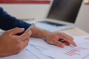 Businessman touch investment growth graph chart and analysing growth achievement diagram data...