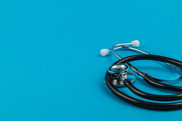 Stethoscope on a blue background supports cancer awareness initiatives