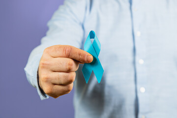 Support awareness for men's health with a blue ribbon symbol