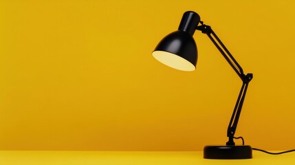 Black Desk Lamp on Yellow Background: Minimalist Study Still Life