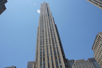 Manhattan engulfed in flames. A lone firefighter, a beacon of courage in yellow, charges into a blaze with a hose. Smoke billows from shattered windows, but this image transcends firefighting; it