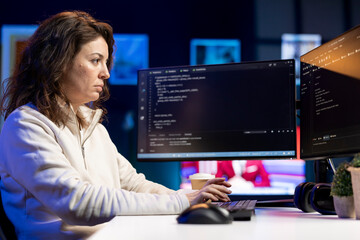 System administrator fixing vulnerabilities in software enabling hackers to compromise operating...