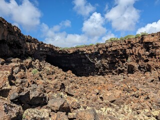 Volcanic cave system known as Jameo Cumplido near Haria, Lanzarote, Spain, part of the lava tube network connected to Cueva de los Verdes, showcasing raw geology.