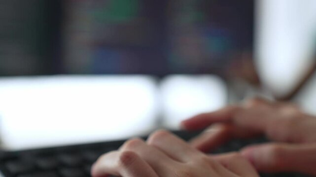 Slow motion closeup hand, back end software developer engineer for computer programming working together on debugging writing computing code, solving complex algorithms display on monitor. Burgeoning