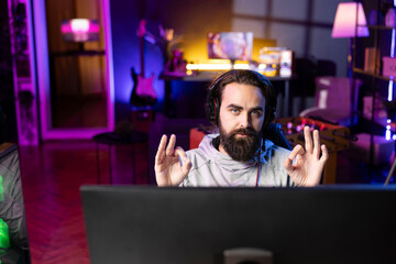 Portrait of gamer discussing with audience multiplayer videogame match winning strategies during...