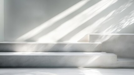 Minimalist interior with light casting shadows on concrete steps in a serene environment