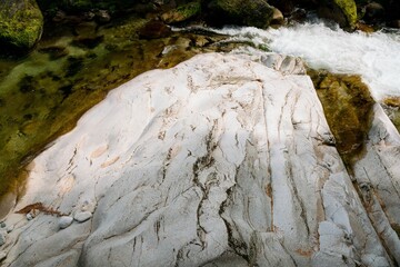 Clear Water Flows Over Light Rock – Serene Natural Stream Scene