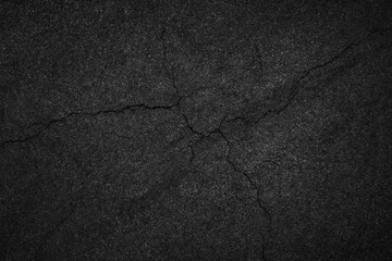 Crack background texture of rough asphalt top view.