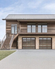 Modern wooden house with garage and balcony in a serene landscape