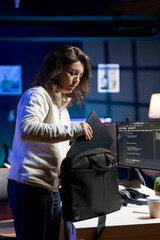 Computer scientist arriving in office, ready to design and develop software applications on laptop....