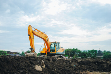 Obraz premium Excavator is building a road at a construction site