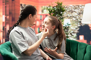 In therapy, mother scolds her disobedient daughter over misconduct, reflecting the generational conflict, stubbornness and manipulation often seen in troubled family dynamics during puberty.