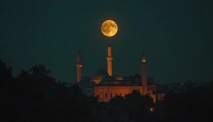 Large Orange Moon Over Illuminated Mosque at Night