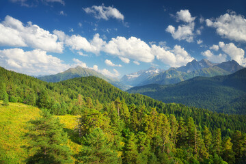 Nature landscape scene of mountain range and blue sky with clouds at day