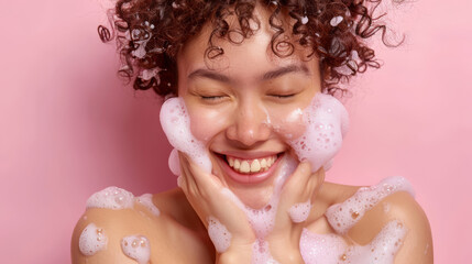 Fototapeta premium Playful woman enjoying pink foam skincare routine 