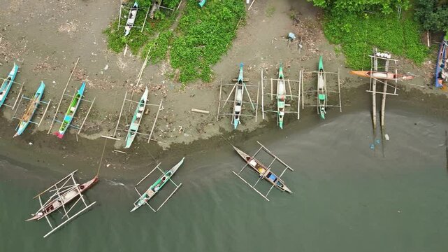 Fishing Boats on Shore, Philippines: Coastal Scene with Traditional Boats (Aerial View)