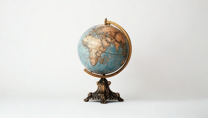 Vintage globe on pedestal against white background