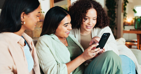 Women, friends and phone with gossip for social media, joke or trust with funny meme in living room. Happy people, support and smile for bonding, blog post and memories in home lounge for reunion