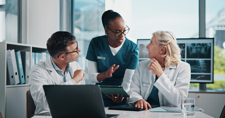 Hospital, nurse and doctors on tablet in meeting for consulting, teamwork and medical advice....