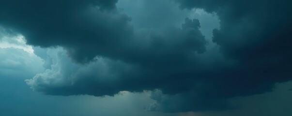 Obraz premium Ominous, dark grey clouds fill the frame, heavy rain imminent , thunderclouds, texture, grey