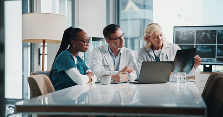 Hospital, x ray and doctors on laptop in meeting for consulting, teamwork and medical advice....