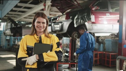 Portrait of White female mechanic inspector, happy working and cheerful, thumbs up with smile in fix car garage, professional engineer check jobs in automotive and transportation industry business.