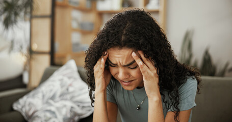 Woman, migraine and stress headache in home, pressure and frustrated with unemployment issue. Pain,...