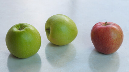 apples stand in a row on a white background