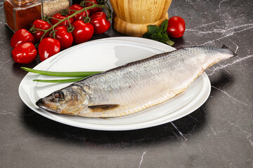 Whole raw salted herring fish