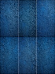 A blue wall with a textured surface. The wall is made up of six different blue tiles