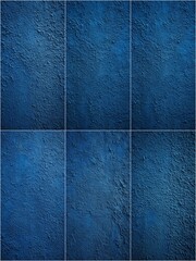 A blue wall with a blue background. The wall is made of concrete and has a rough texture