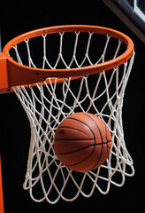 Basketball going through hoop, dramatic lighting, black background, high contrast, close-up shot, orange basketball, red rim, white net, sports photography, motion frozen in time