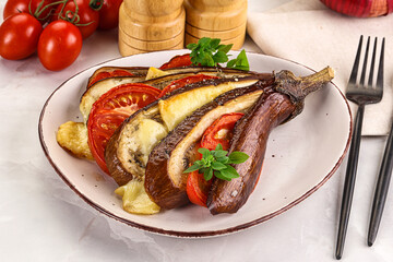 Baked tomato with mozzarella and tomato