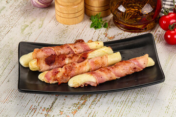 Hot mozzarella sticks with bacon